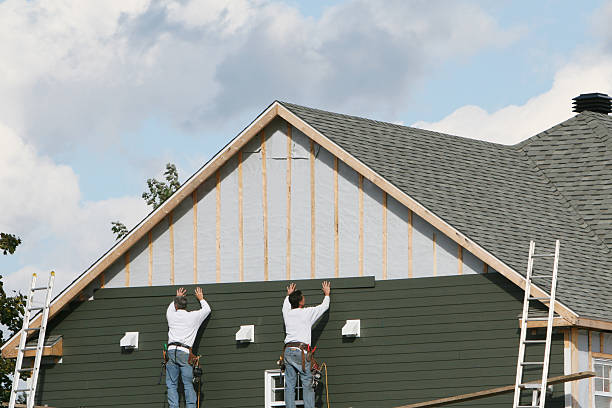 Professional Storm Damage Siding Repair technician working in Summit, IL